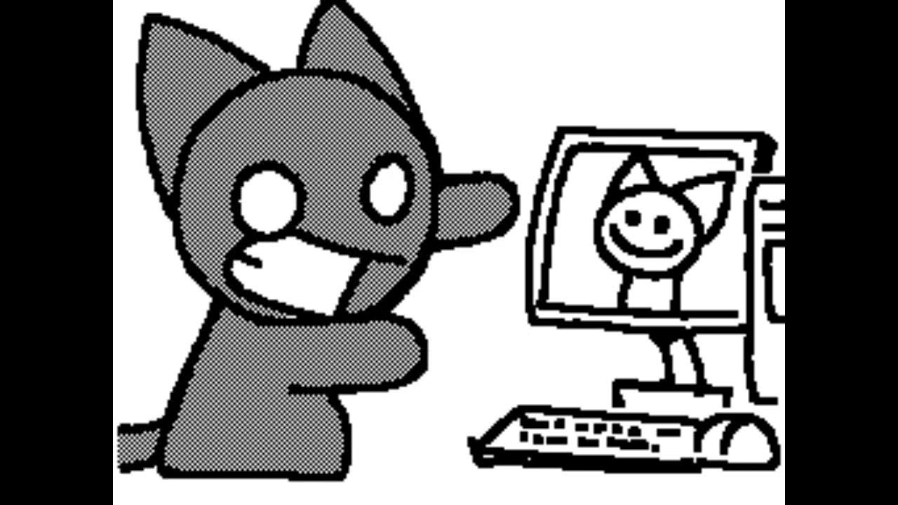 A screenshot of Fuzz, a grey cat, guesturing towards a desktop computer with a similar looking cat on its screen.
