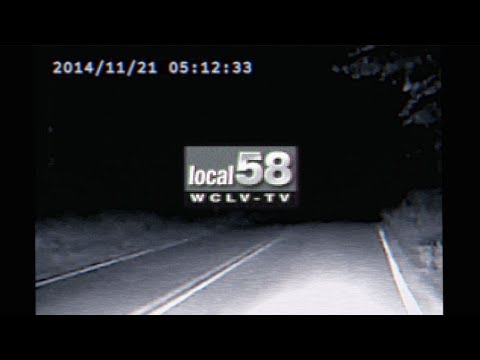 A screenshot of a greyscale image of a road at night, with the logo for Local 58 in the middle of the screen.