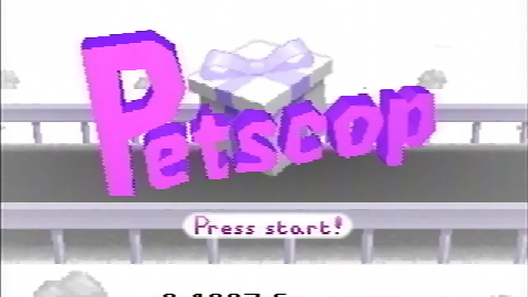 A screenshot of the titlescreen for the game, a white present with a lavender ribbon with purple 3D text saying Petscop.